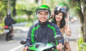 commercial motorcycle taxi driver taking his passenger 8595 727