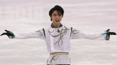 Mikhail Shaidorov merayakan emas tunggal putra figure skating usai tampil gemilang di final Olimpiade Milan–Cortina.