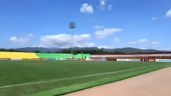 Lapangan hijau Stadion Gelora BJ Habibie Parepare dengan tribun berwarna dan latar pegunungan